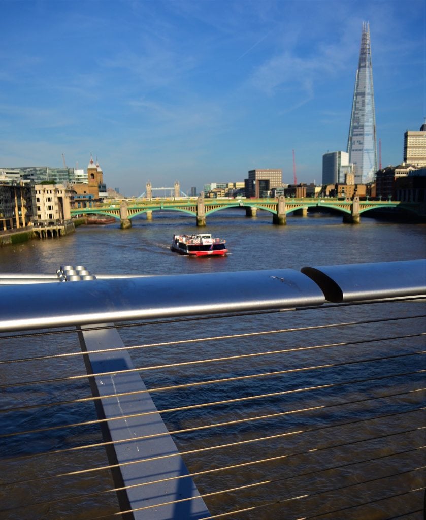 The view downriver from the Millennium Bridge shows the Tower Bridge in the distance