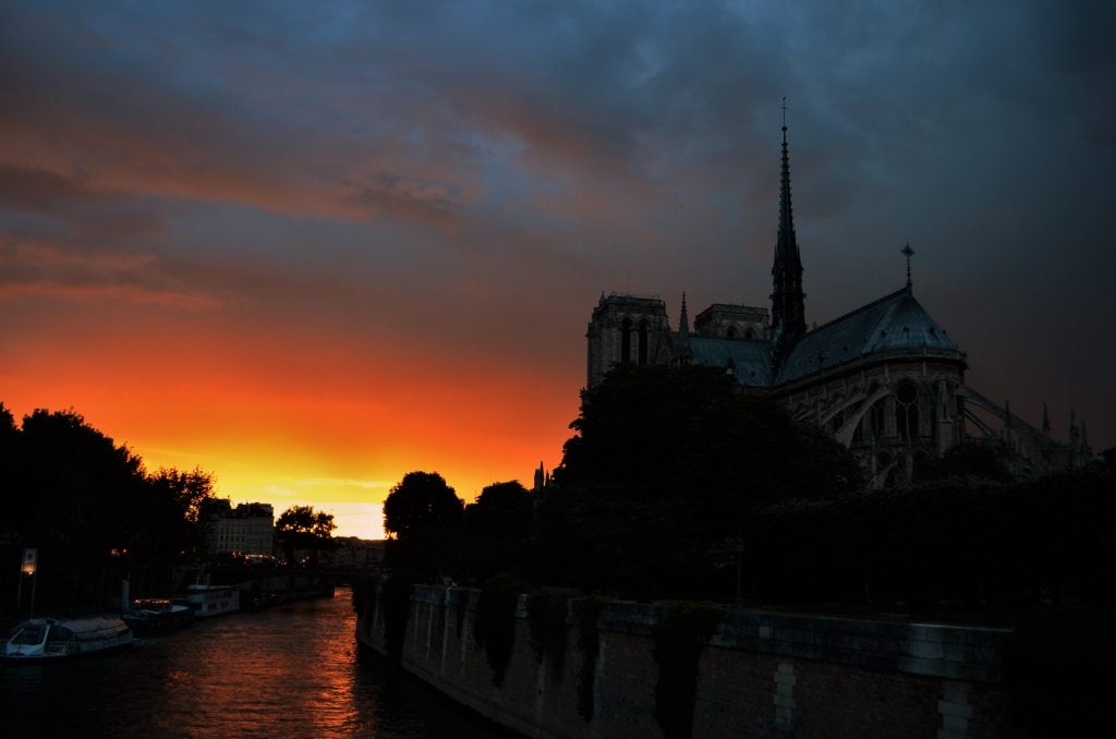 The sun sets over Notre Dame Cathedral
