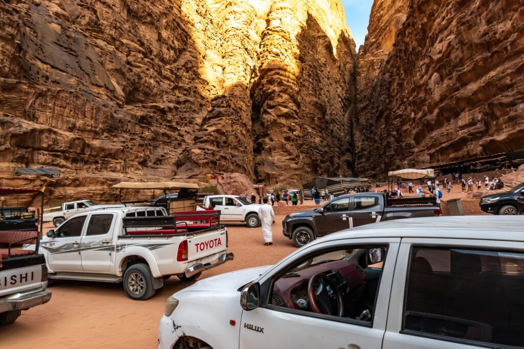 Lots of trucks parked to see the same sight in Wadi Rum