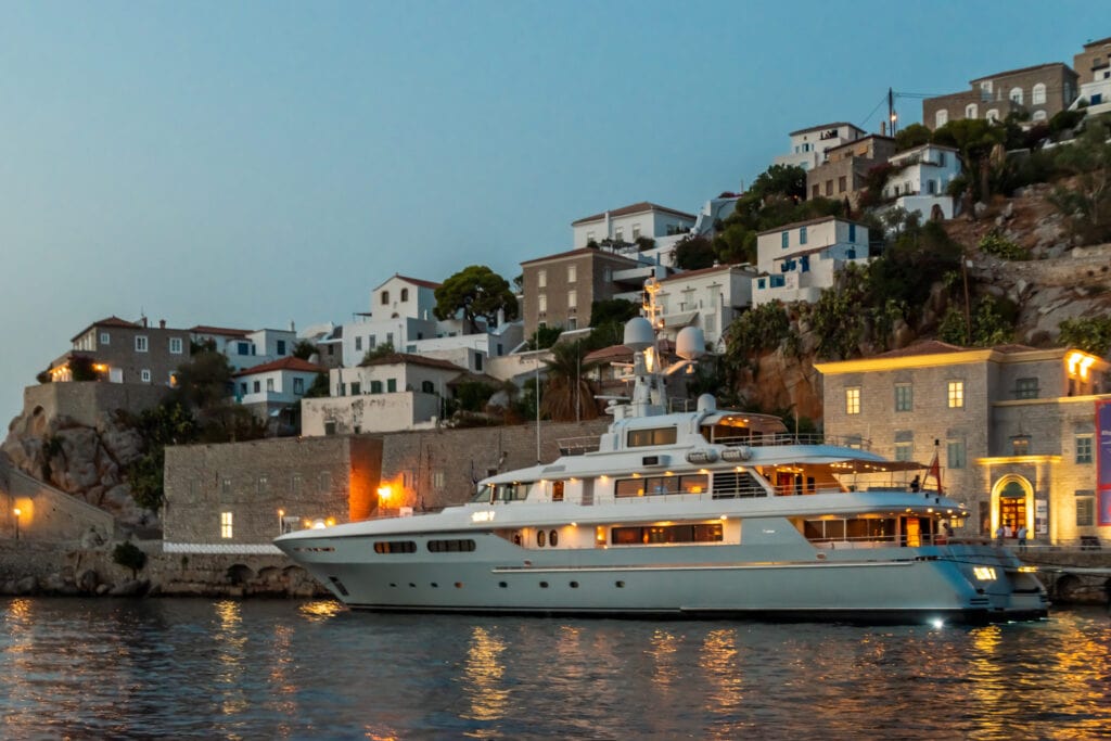One of the large yachts moored at the port in Hydra
