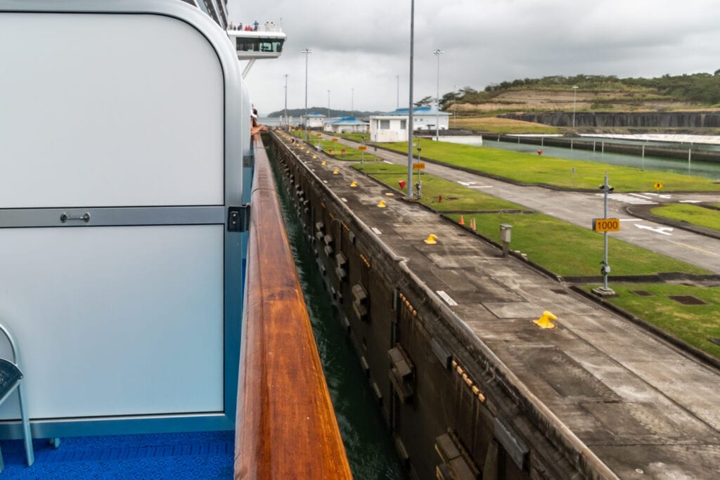 The larger Ruby Princess has only a few feet pf space to spare on either side of the New Panama Canal Locks