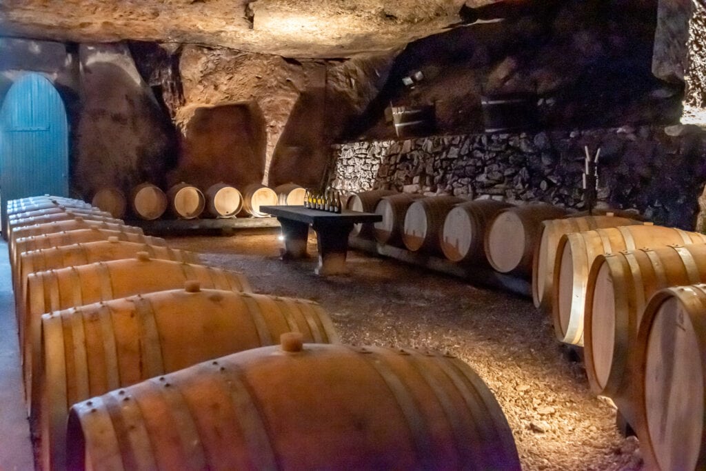 The wooden cask aging cellar at La Perriere