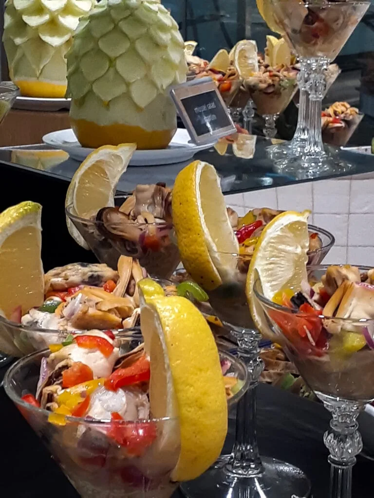 Individual servings of a seafood salad in the buffet