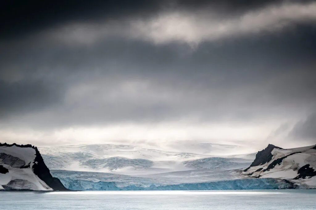 Dark clouds over a glacier in Admiralty Bay