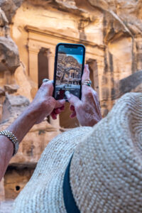 A friend snaps a photo of the Triclinium at Little Petra