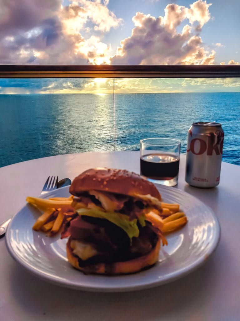 Enjoying a burger and a soda on my balcony
