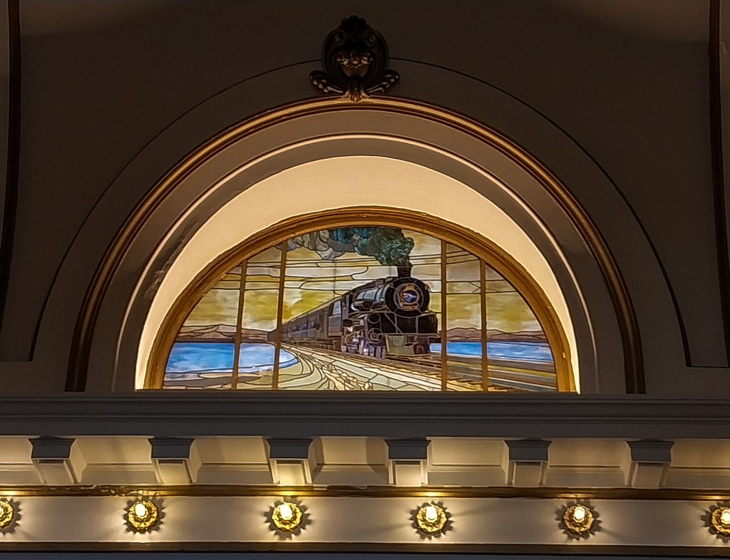 One of the stained glass windows in the Ashe Adams Lobby