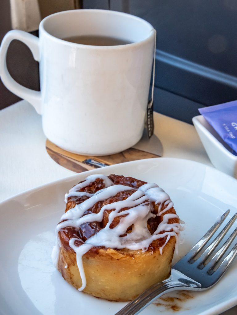 Cinnamon roll and tea breakfast starter on the Canyon Spirit