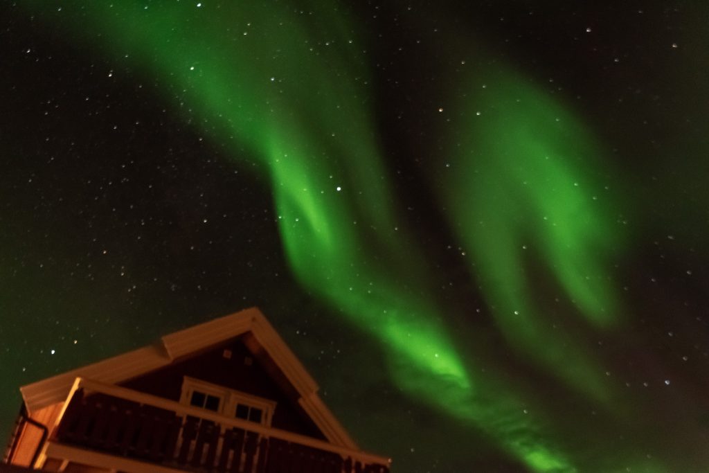 Lights dancing over one of our Norway cabins