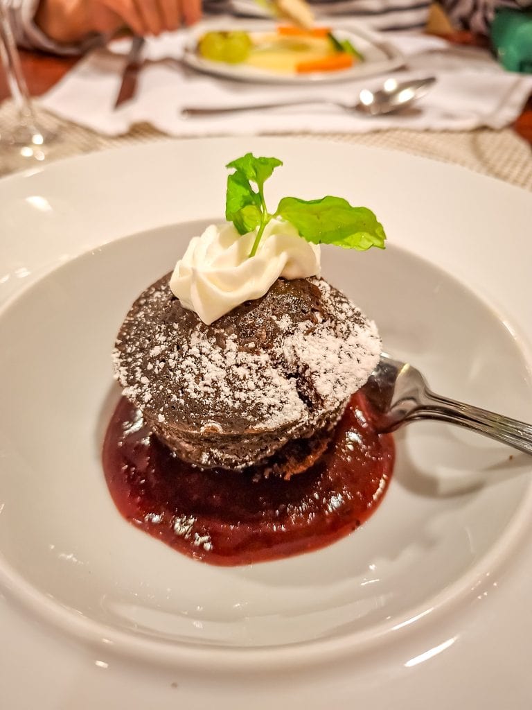 Warm chocolate cake with cherry sauce