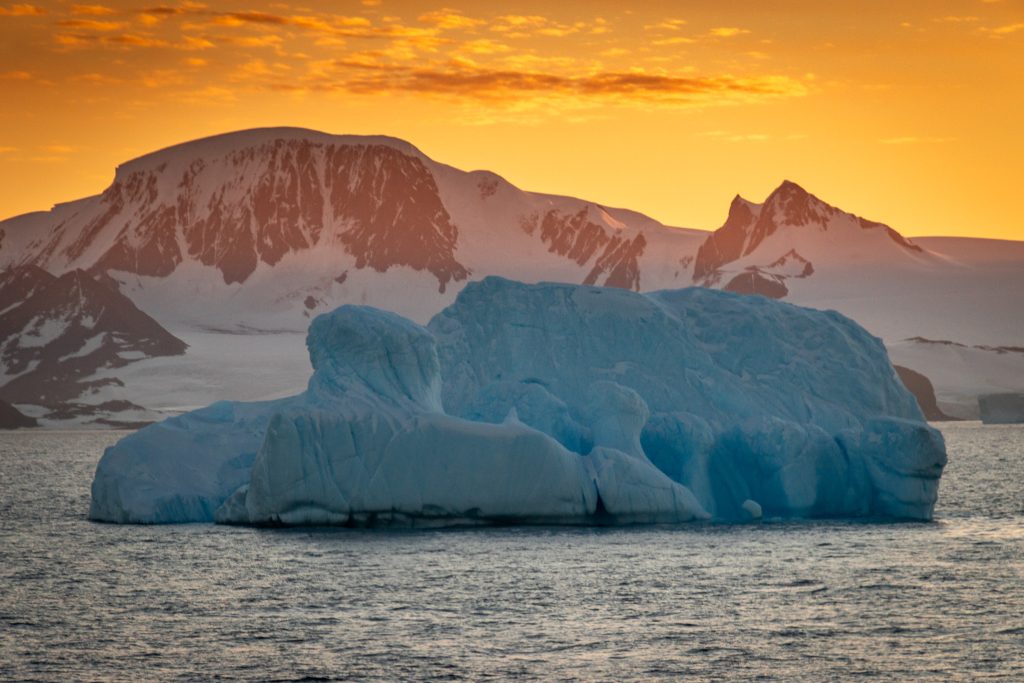 iceberg in Antarctica at sunset