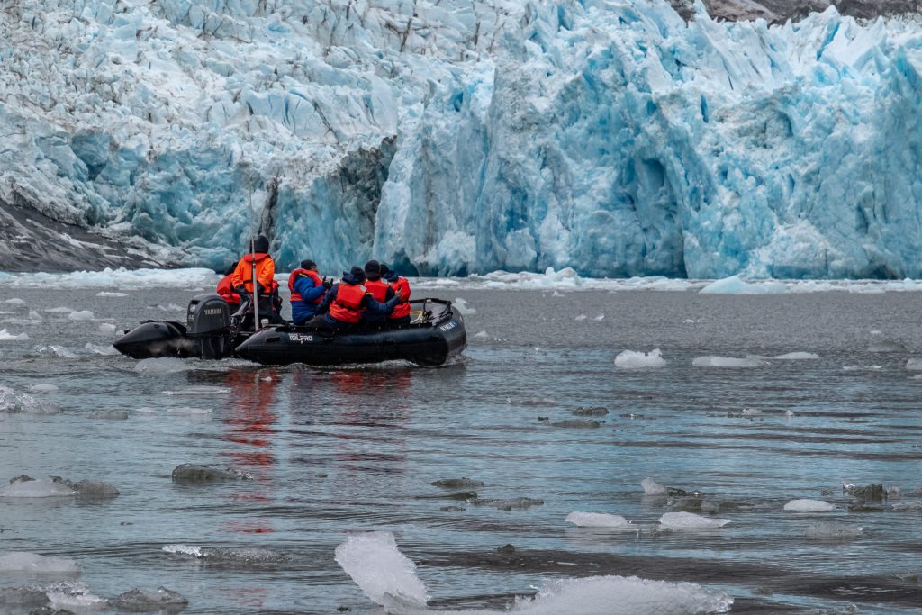 A Zodiac takes guests close to the Dawes glacier
