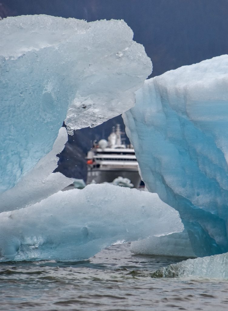 The Windstar peeks through a big iceberg