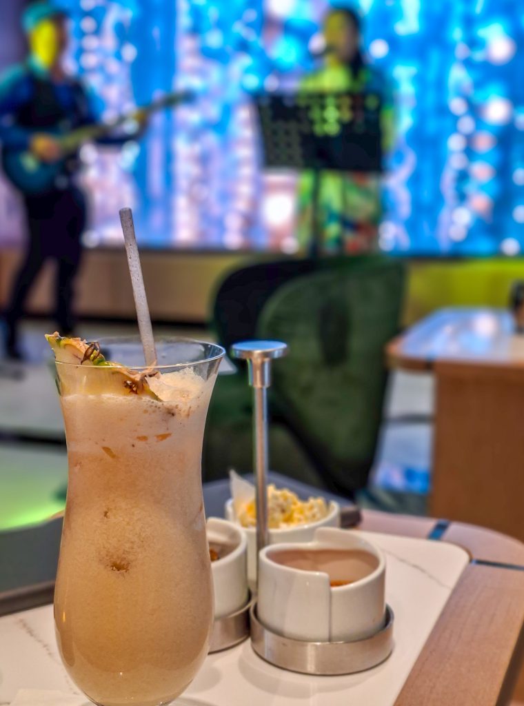 Enjoying a drink in the lounge while listening to music
