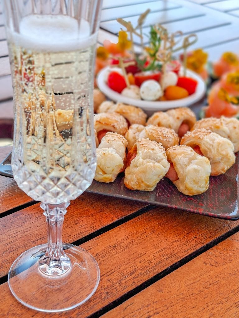 A champagne welcome accompanied by some nibbles
