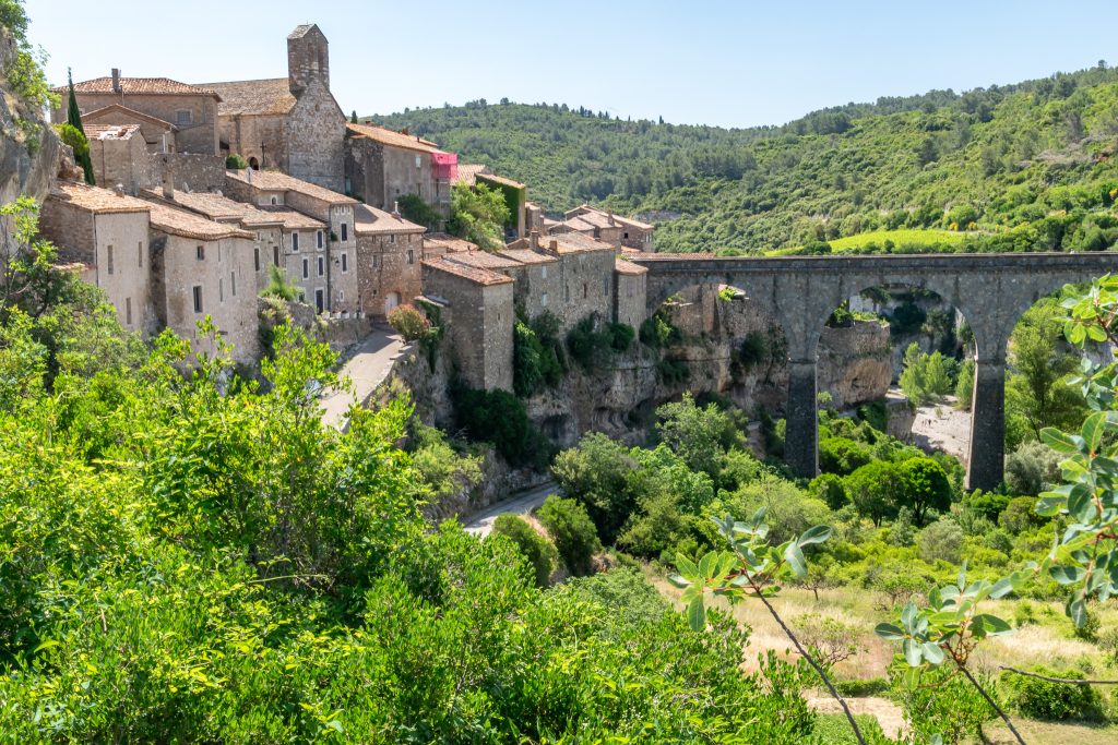 Minerve clings to the side of a cliff
