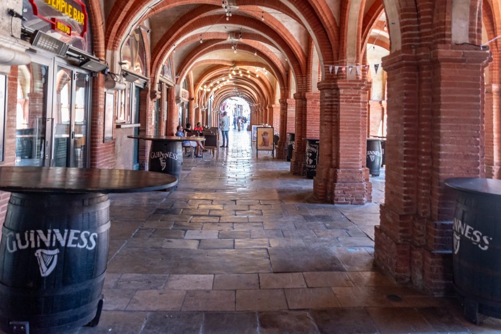 Part of the covered arcades around Place National