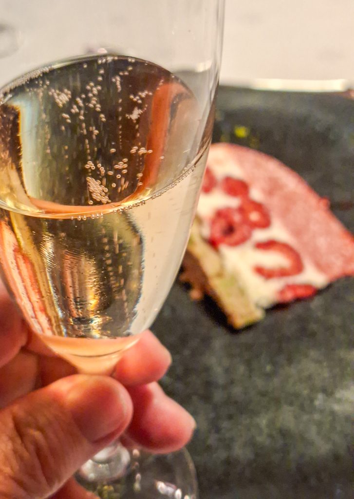 Celebrating with champagen and anniversary cake