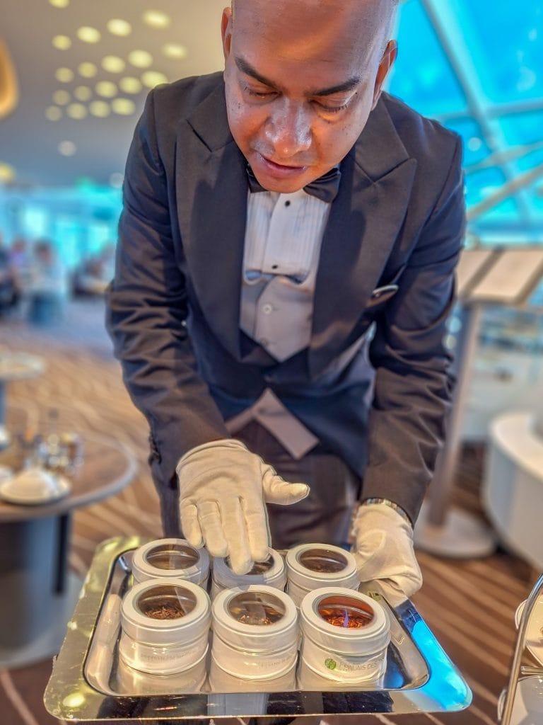 Butler offering tea choices